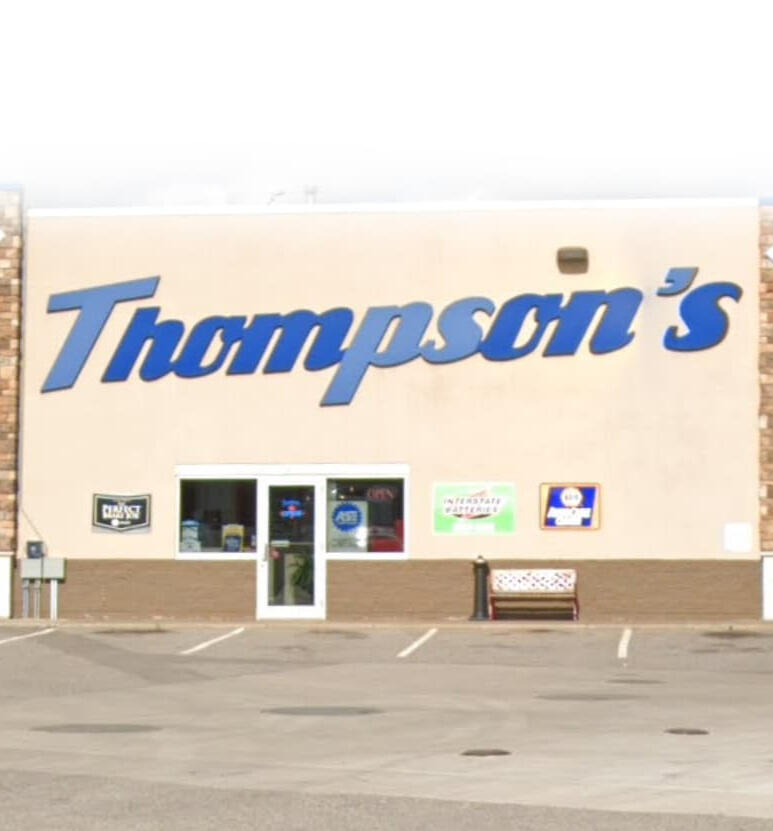 An image of a automotive repair shop front labeled "Thompson"s"